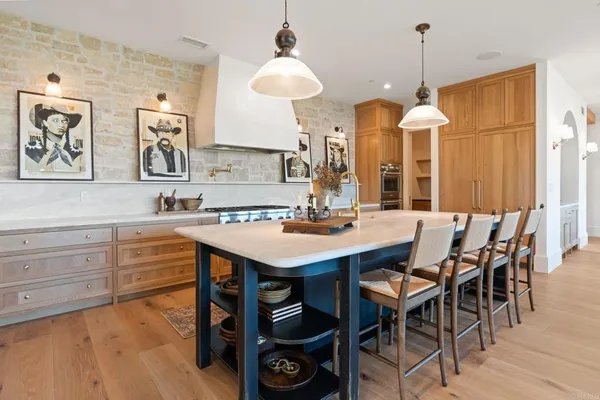 a kitchen with a table and chairs in it