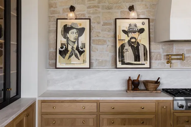 a dining room with furniture a chandelier and wooden floor