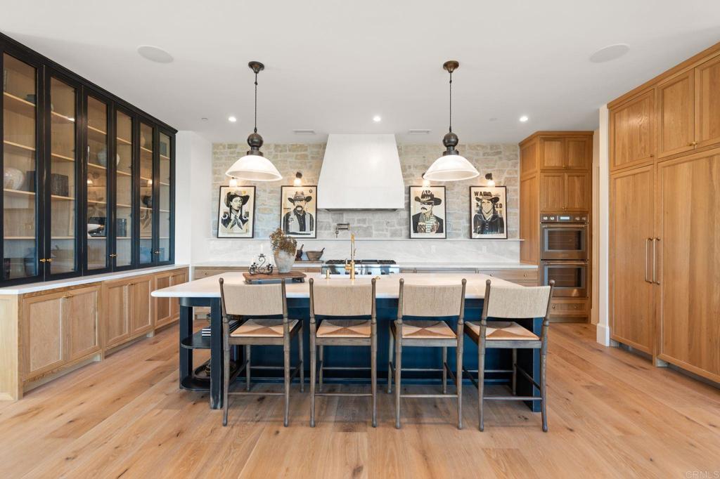 15816 Via Del Alba Rancho Santa Fe, CA 92067 - Photo 8 of 50 a dining room with furniture a chandelier and wooden floor