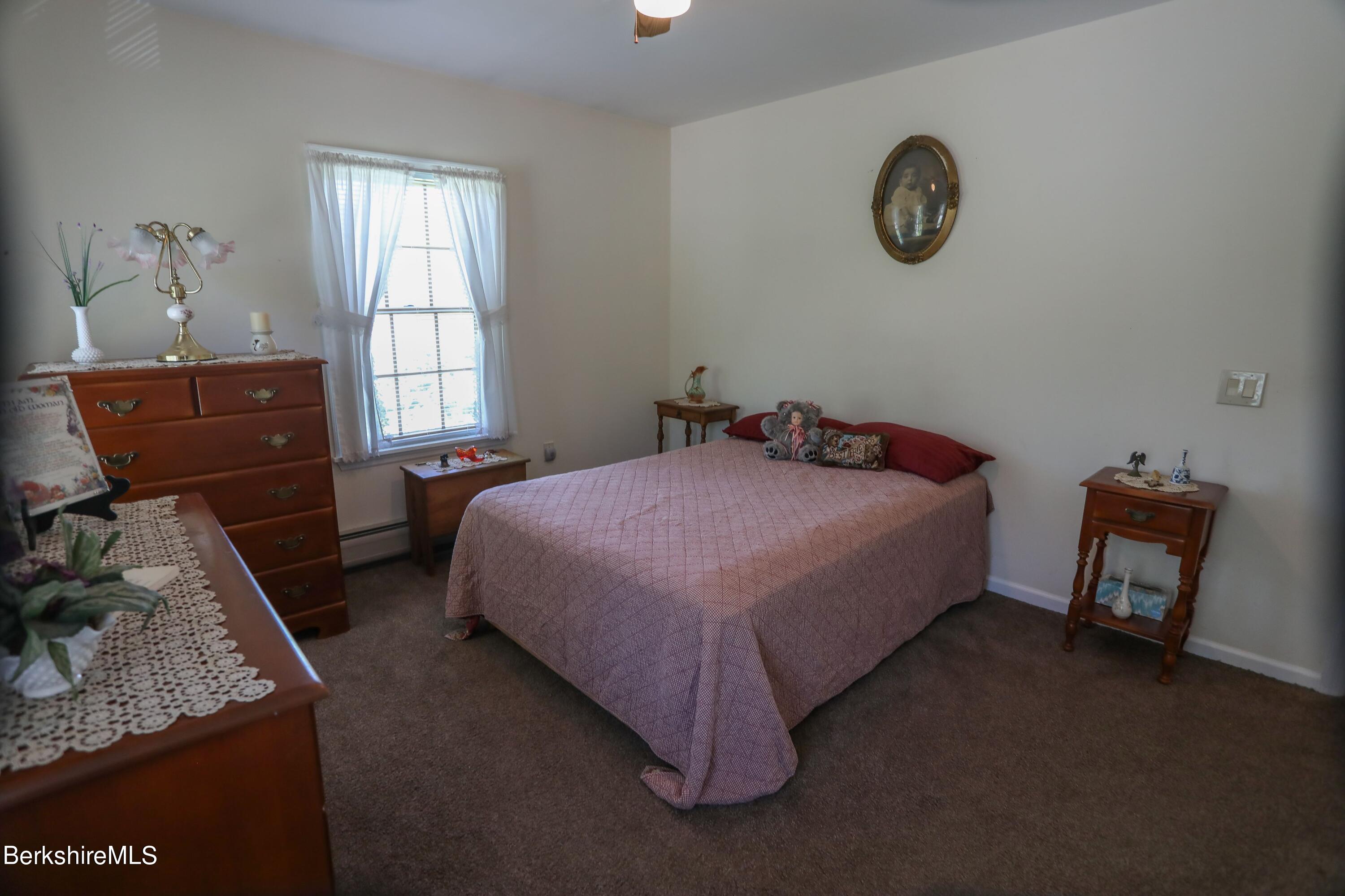 792 Middle Road Clarksburg, MA 01247 - Photo 17 of 40 a bedroom with a bed and a window