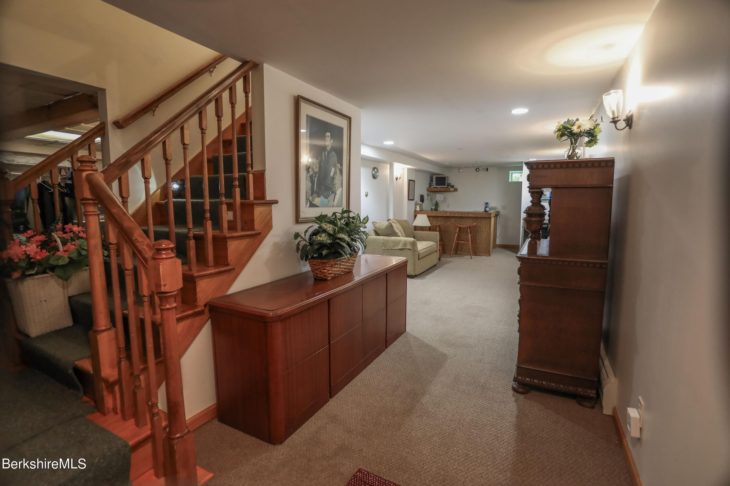 792 Middle Road Clarksburg, MA 01247 - Photo 28 of 40 a living room with furniture and a potted plant