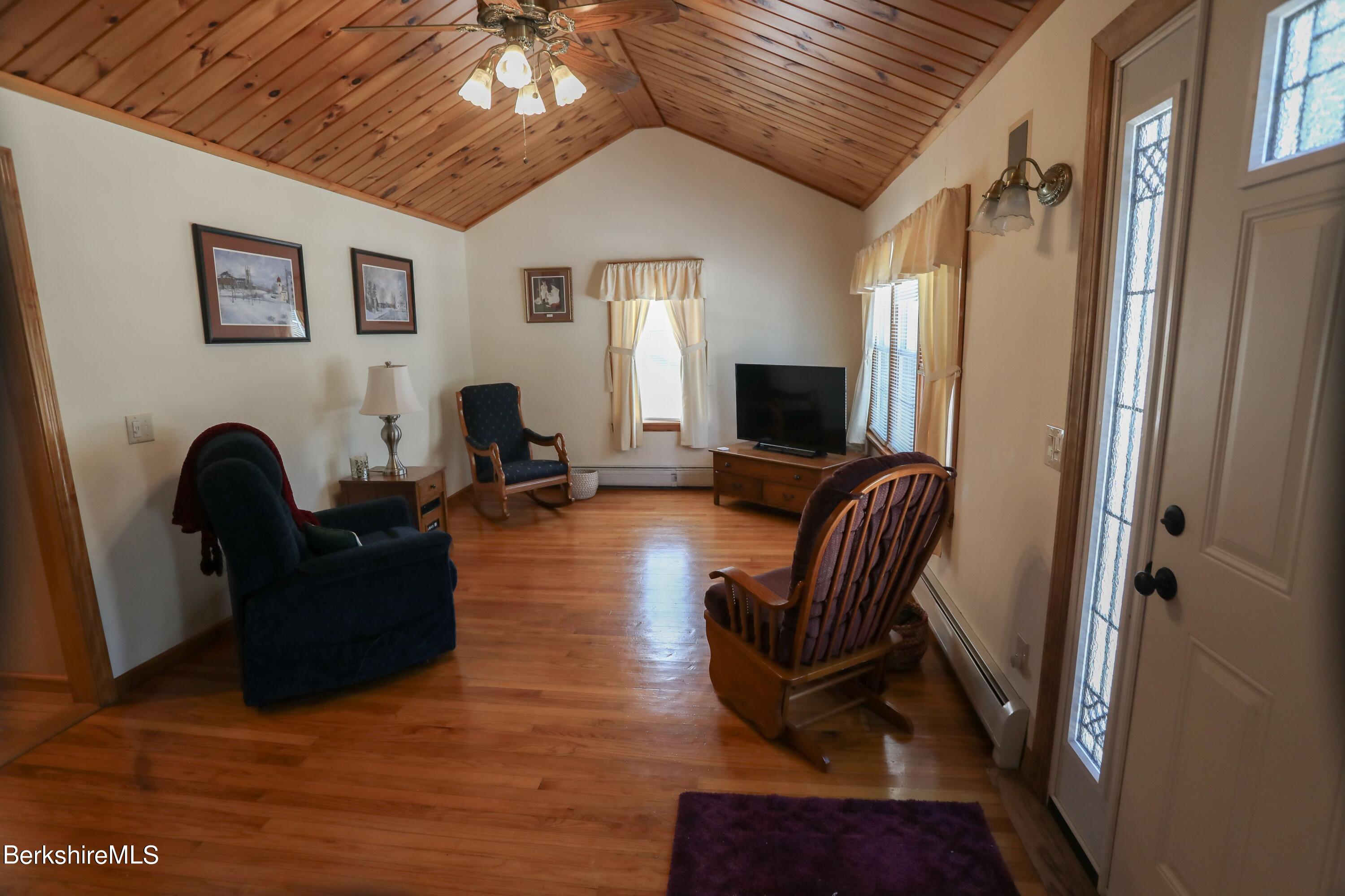 792 Middle Road Clarksburg, MA 01247 - Photo 8 of 40 a living room with furniture and a flat screen tv
