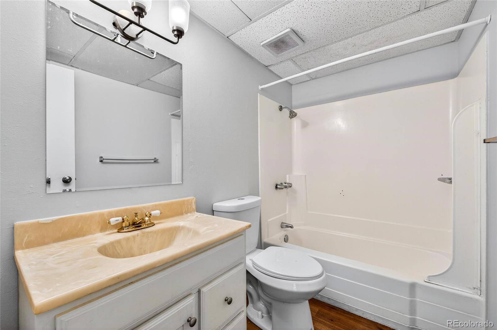 2281 South Vaughn Way Aurora, CO 80014 - Photo 15 of 23 a bathroom with a sink and a mirror