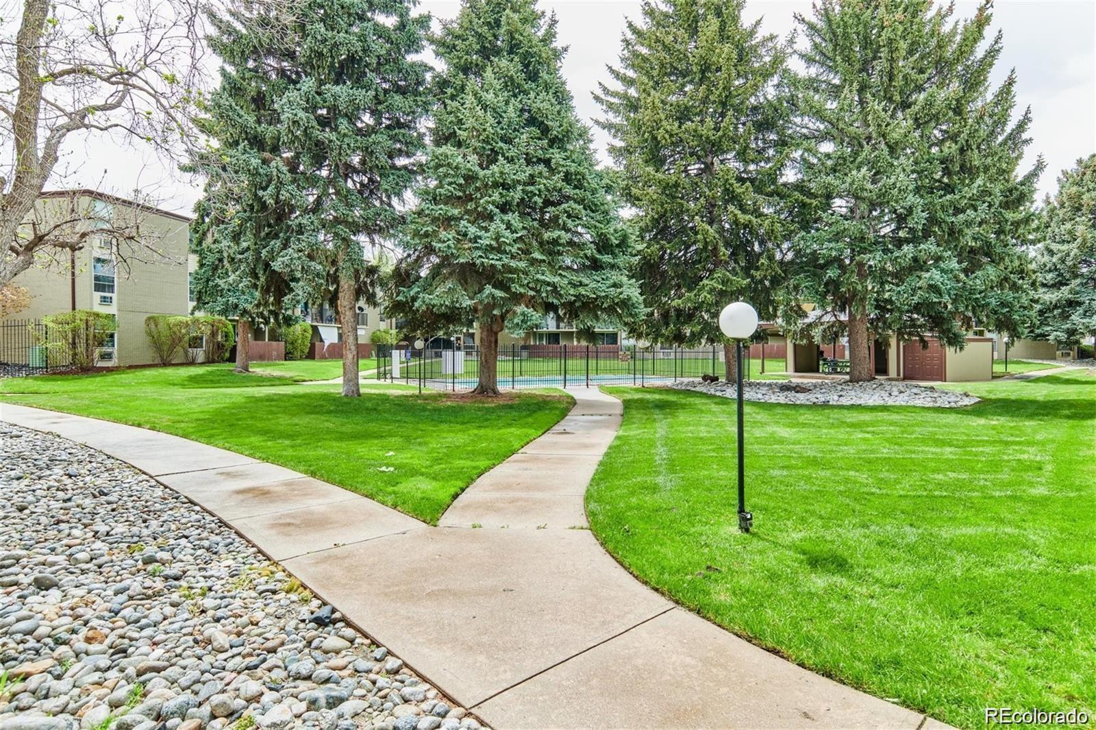 2281 South Vaughn Way Aurora, CO 80014 - Photo 22 of 23 a view of a park with tree s