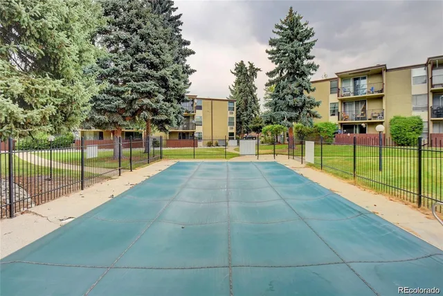 a view of a backyard with floor to ceiling window