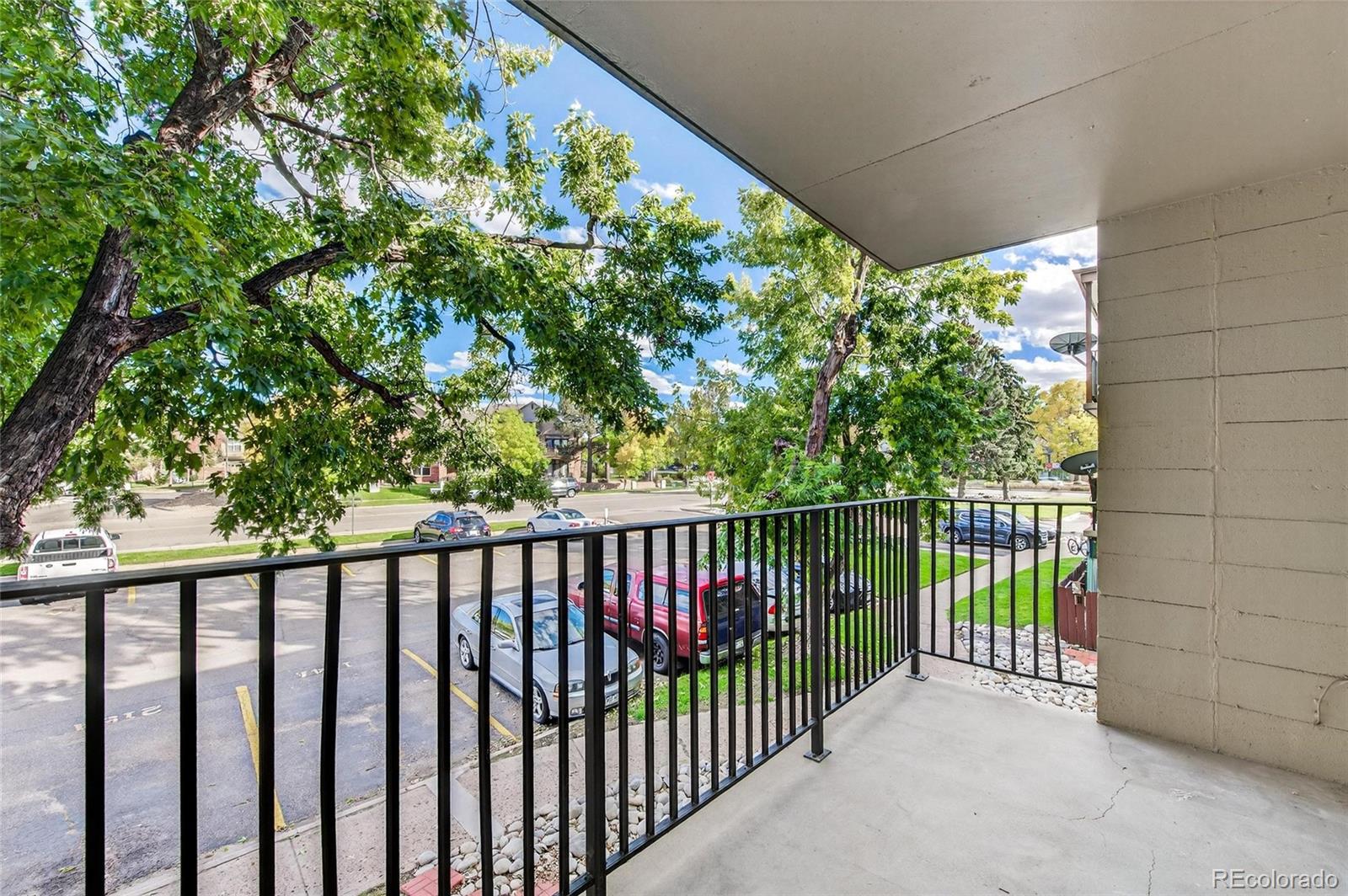 2281 South Vaughn Way Aurora, CO 80014 - Photo 7 of 23 a view of a balcony with plants