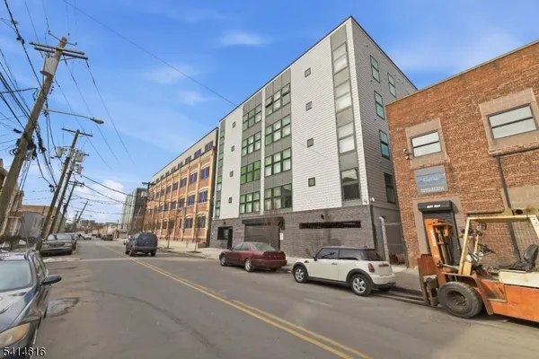 a view of a street with cars