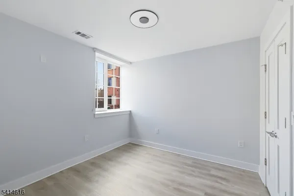 a view of a room that has a window in it