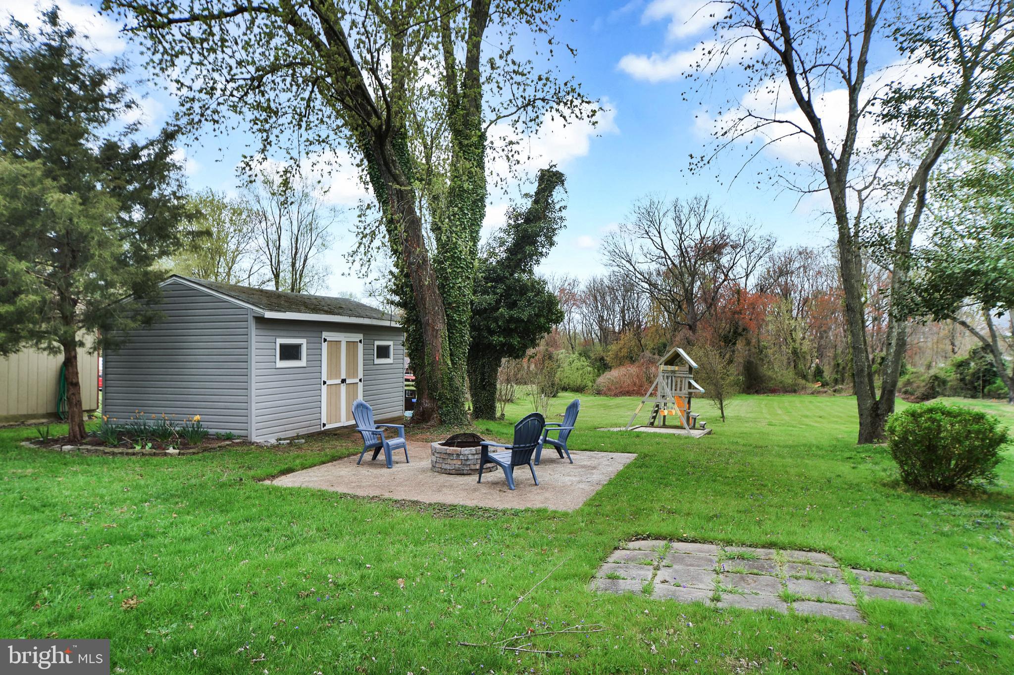 1015 Chesaco Avenue Rosedale, MD 21237 - Photo 21 of 23 Yard with Playset, Fire Pit, and Shed