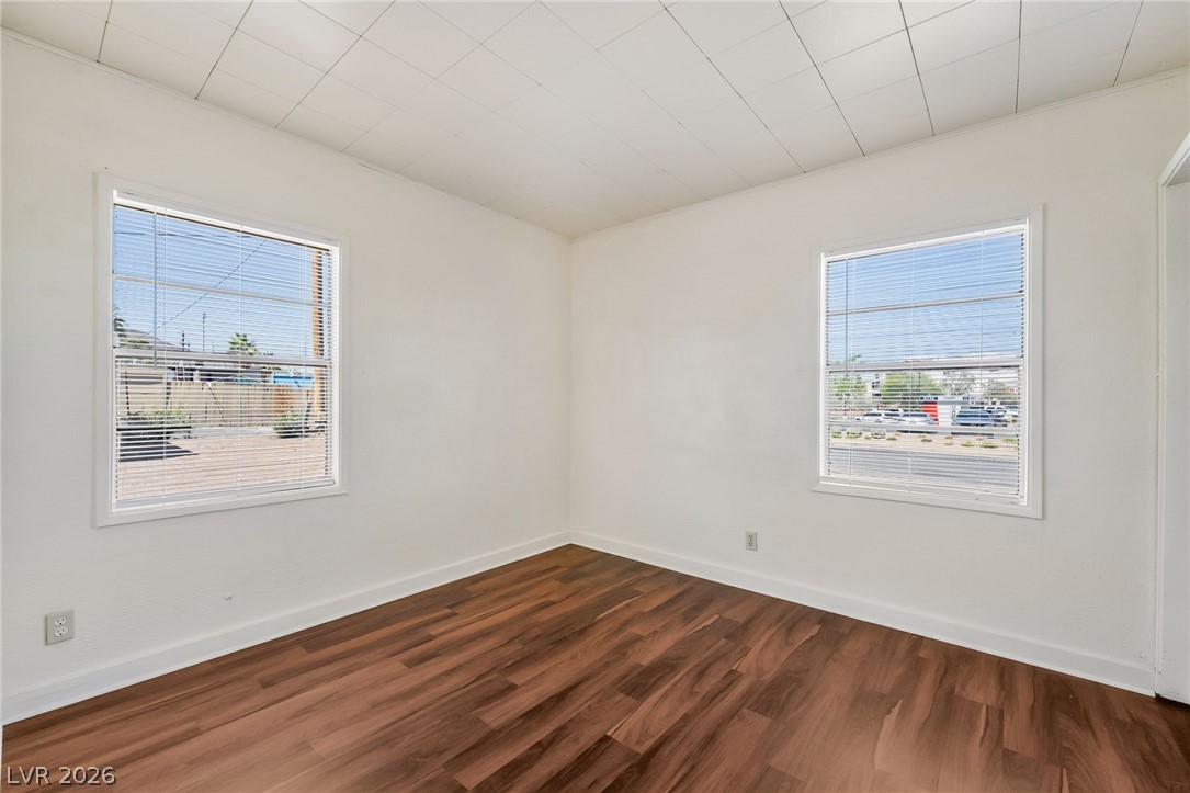 2 California Way Henderson, NV 89015 - Photo 15 of 29 Rich wood like flooring complements the bright, naturally illuminated space.