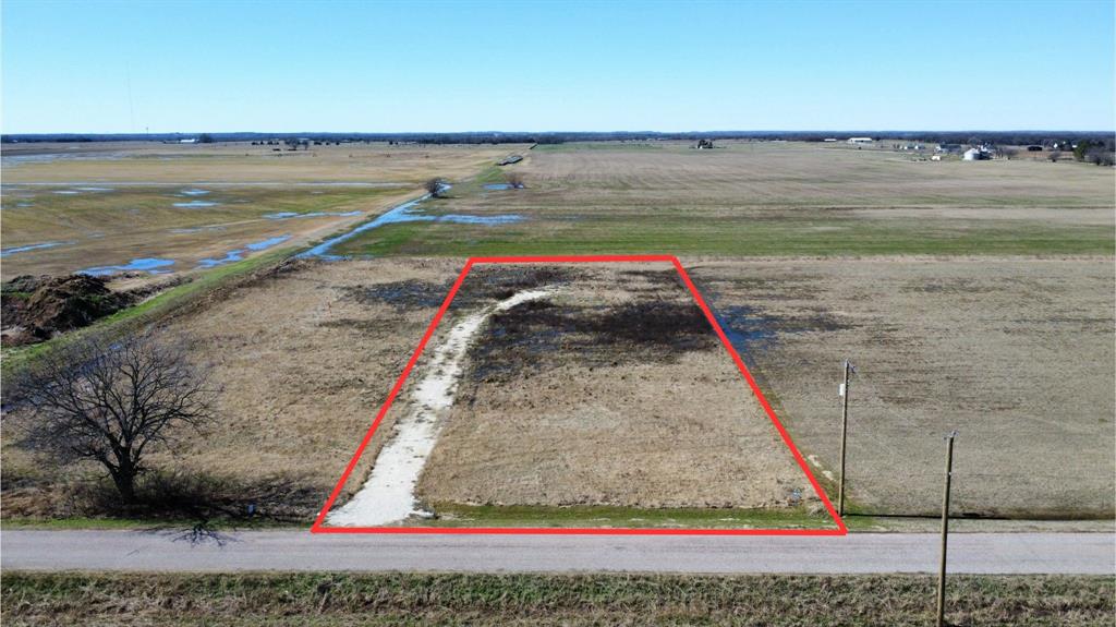 1709 Dawkins Road Collinsville, TX 76233 - Photo 2 of 4 a view of a lake with a yard