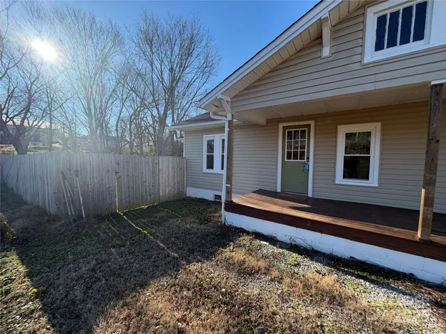 a house with trees in the background