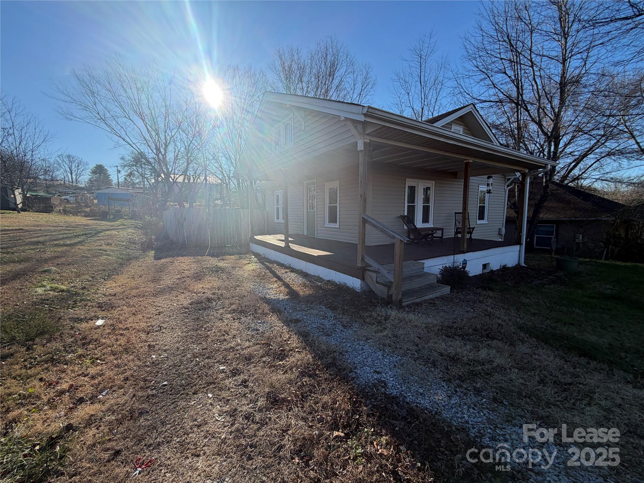 31 Carolina Avenue Marion, NC 28752 - Photo 3 of 11 a view of backyard with wooden fence and large trees