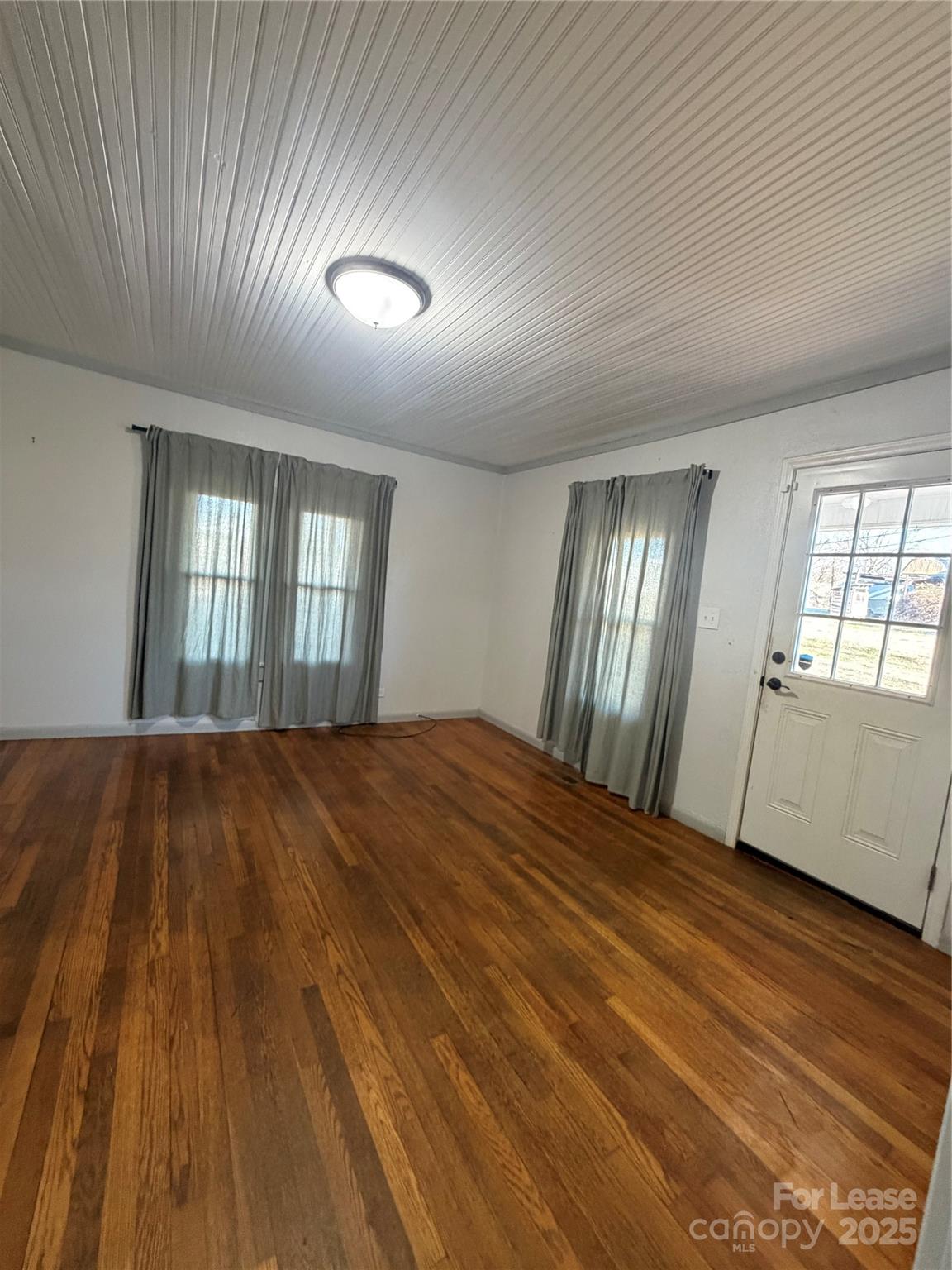 31 Carolina Avenue Marion, NC 28752 - Photo 5 of 11 wooden floor in an empty room with a window