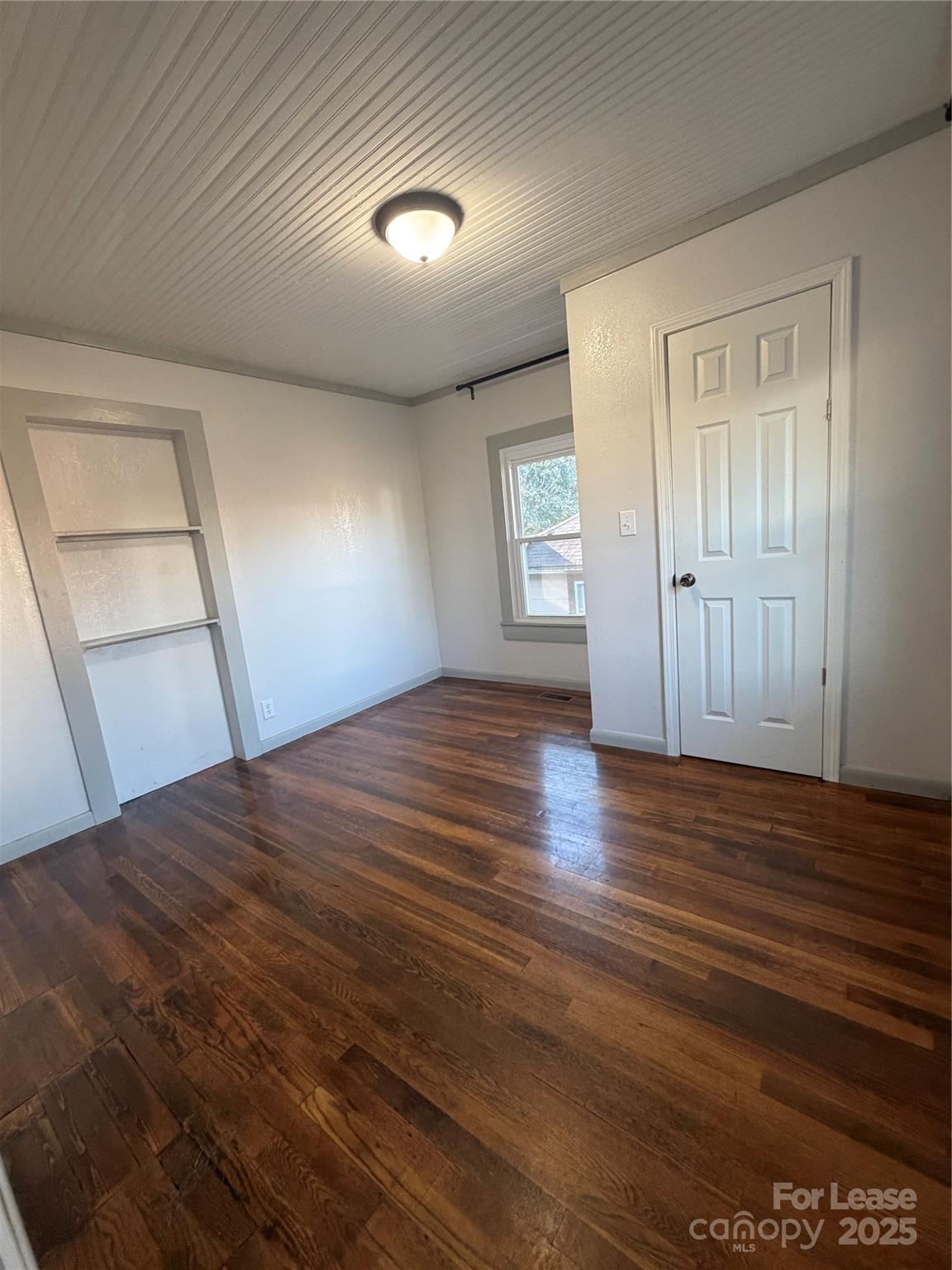 31 Carolina Avenue Marion, NC 28752 - Photo 6 of 11 wooden floor in an empty room with a window