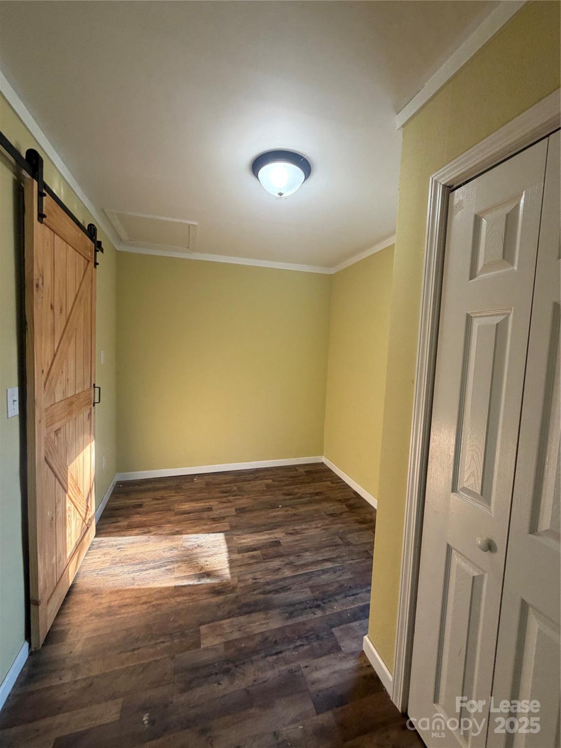 31 Carolina Avenue Marion, NC 28752 - Photo 10 of 11 a view of an empty room with wooden floor and a window