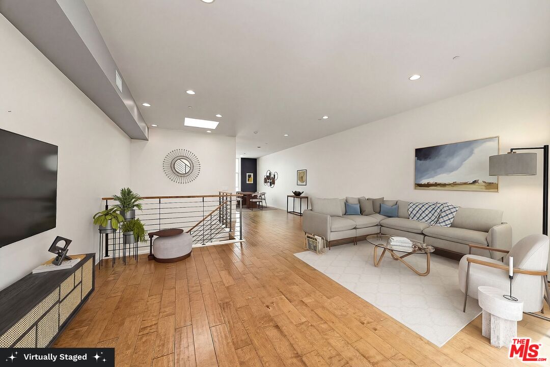 3119 Vía Dolce, Unit 302 Marina del Rey, CA 90292 - Photo 1 of 27 a living room with furniture and a flat screen tv