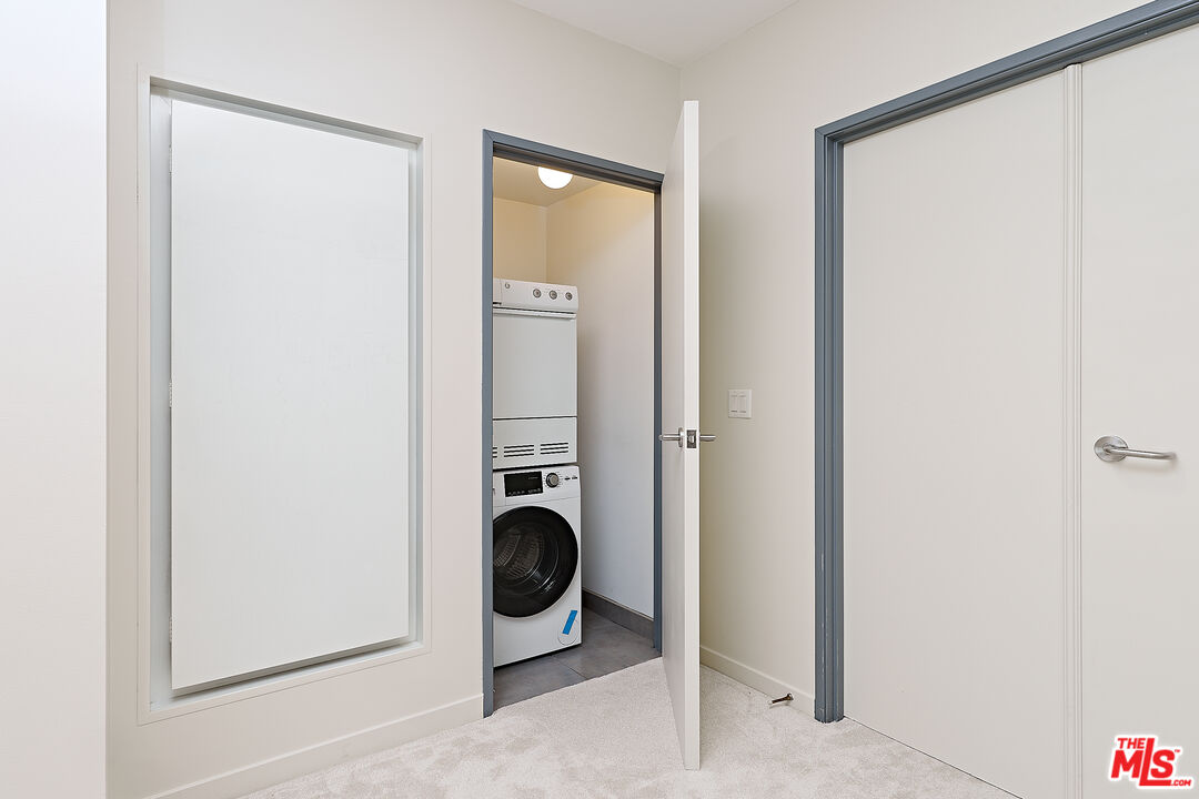 3119 Vía Dolce, Unit 302 Marina del Rey, CA 90292 - Photo 13 of 27 a view of a storage & utility room with washer and dryer