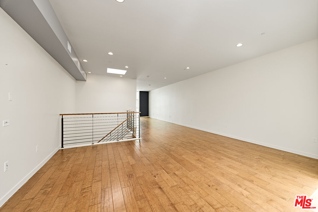 3119 Vía Dolce, Unit 302 Marina del Rey, CA 90292 - Photo 22 of 27 a view of an empty room with wooden floor