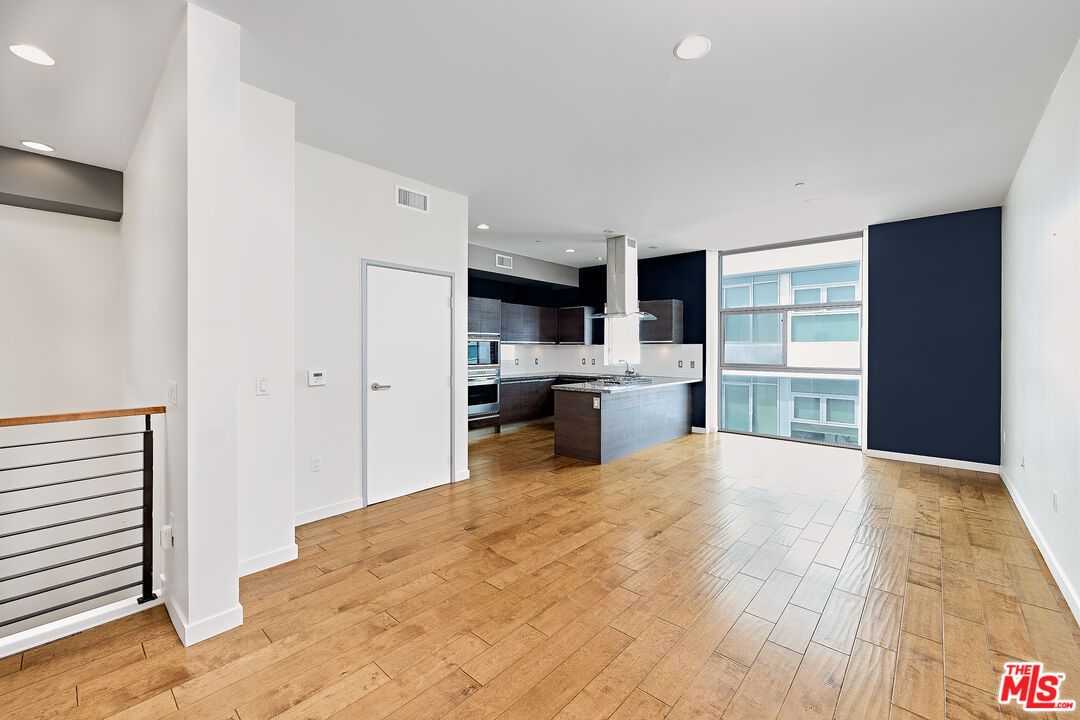 3119 Vía Dolce, Unit 302 Marina del Rey, CA 90292 - Photo 24 of 27 a room with a bed and a large window