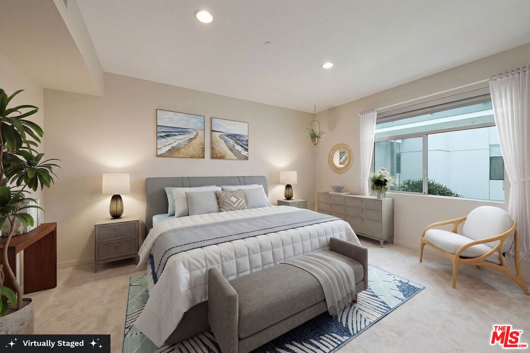 3119 Vía Dolce, Unit 302 Marina del Rey, CA 90292 - Photo 3 of 27 a spacious bedroom with a bed and a couch