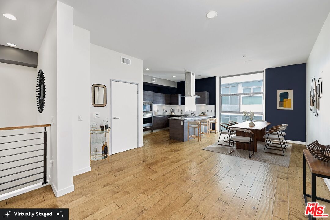 3119 Vía Dolce, Unit 302 Marina del Rey, CA 90292 - Photo 7 of 27 a living room with furniture and a large window