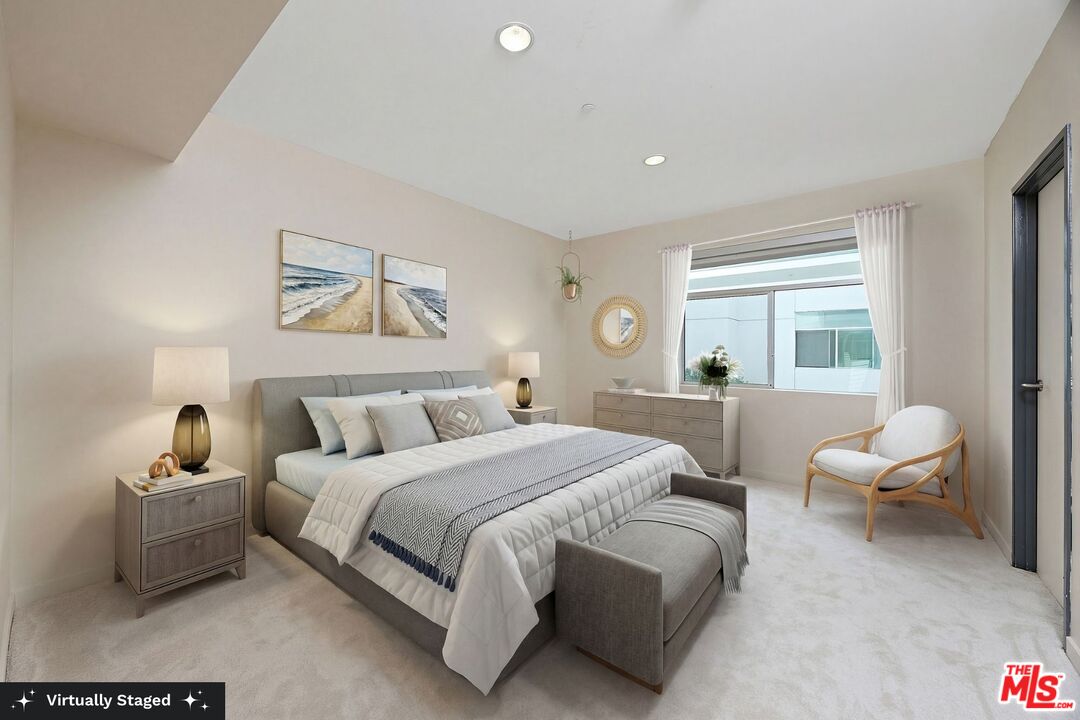 3119 Vía Dolce, Unit 302 Marina del Rey, CA 90292 - Photo 10 of 27 a bedroom with a bed and a couch