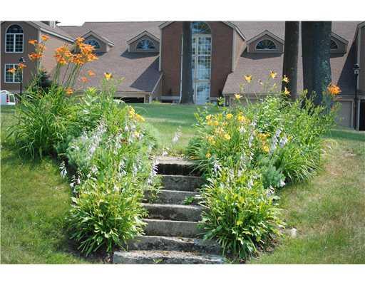 39 Turtle Run Road, Unit 9 Winthrop, ME 04364 - Photo 24 of 25 Exterior Front. Beautiful landscaping!