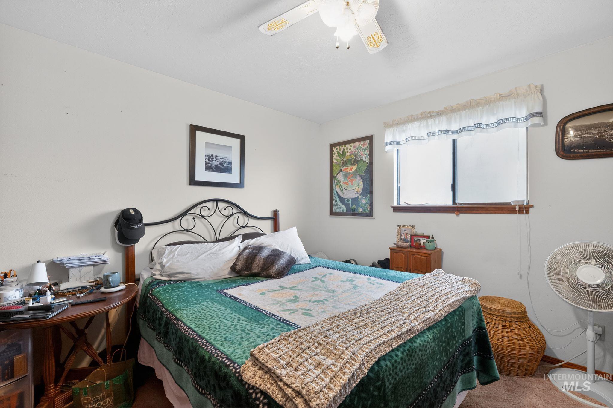 1055 South Adell Street Filer, ID 83328 - Photo 17 of 28 Carpeted bedroom featuring ceiling fan