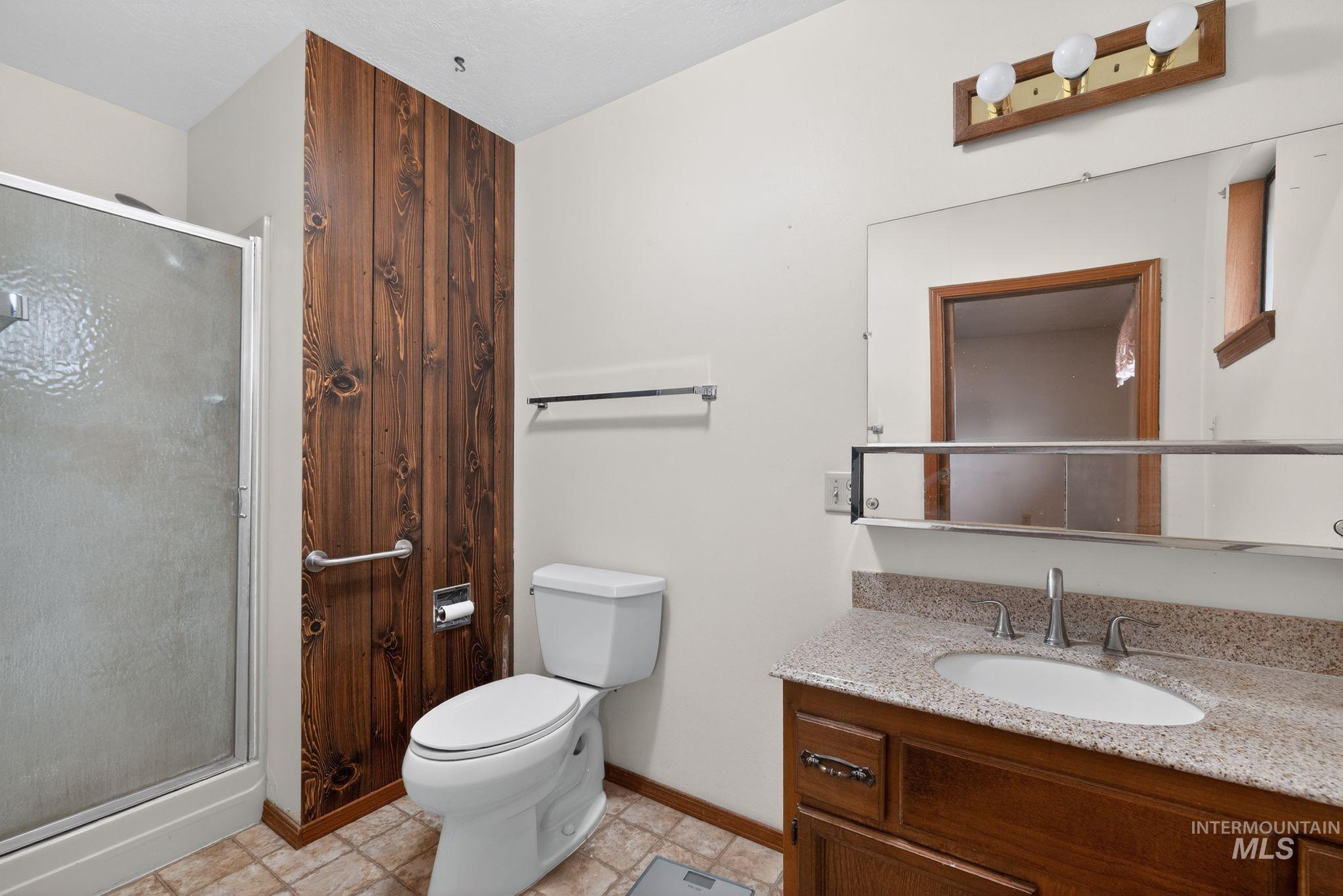 1055 South Adell Street Filer, ID 83328 - Photo 25 of 28 Bathroom featuring a shower stall and vanity