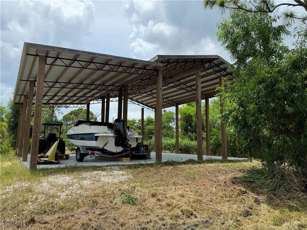 Island Ridge Road Bokeelia, FL 33922 - Photo 4 of 10 a car parked in front of a house