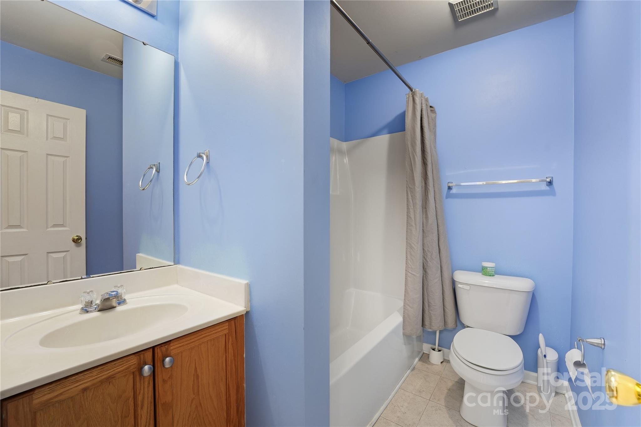 5822 Meeting Street Concord, NC 28025 - Photo 16 of 21 a bathroom with a sink toilet and shower