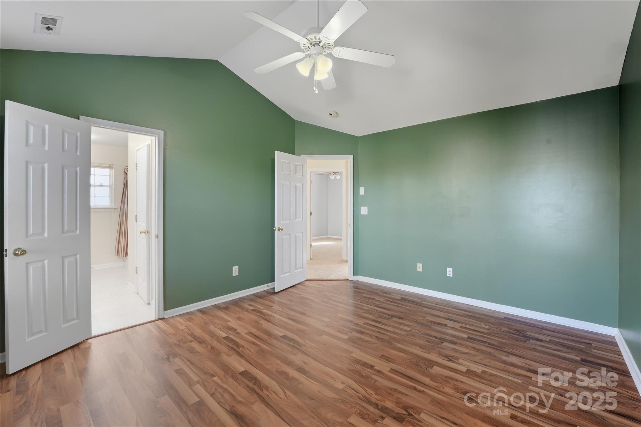 5822 Meeting Street Concord, NC 28025 - Photo 8 of 21 wooden floor in an empty room with a fan