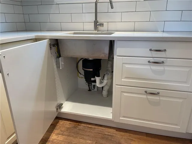 a sink with a washer and dryer