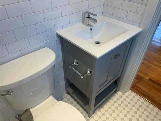 a bathroom with a sink and mirror