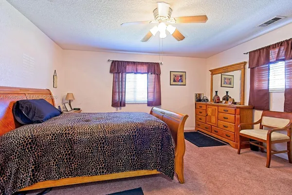 a bedroom with a bed and furniture