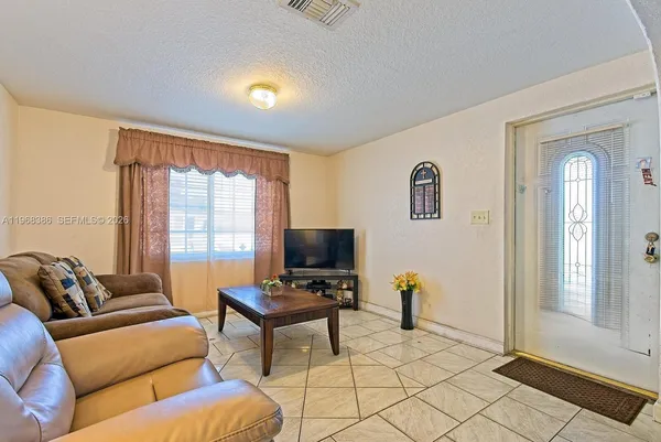 a living room with furniture and a window