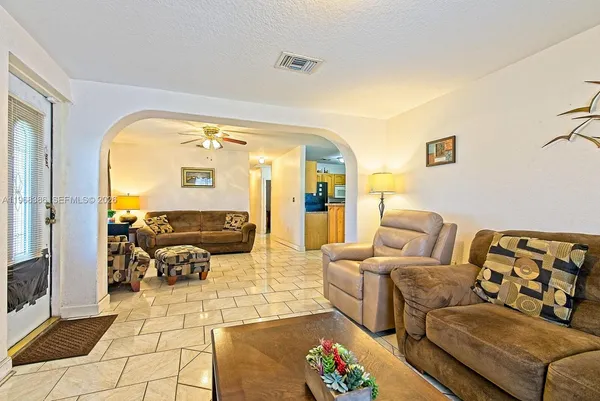 a living room with furniture and a large window