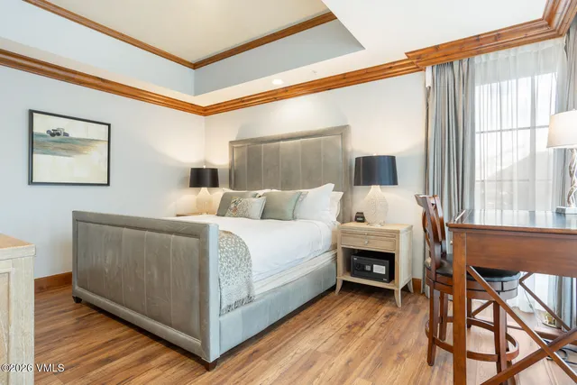 a bed room with a bed and a chair