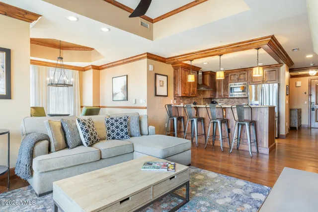 a living room with furniture and a table