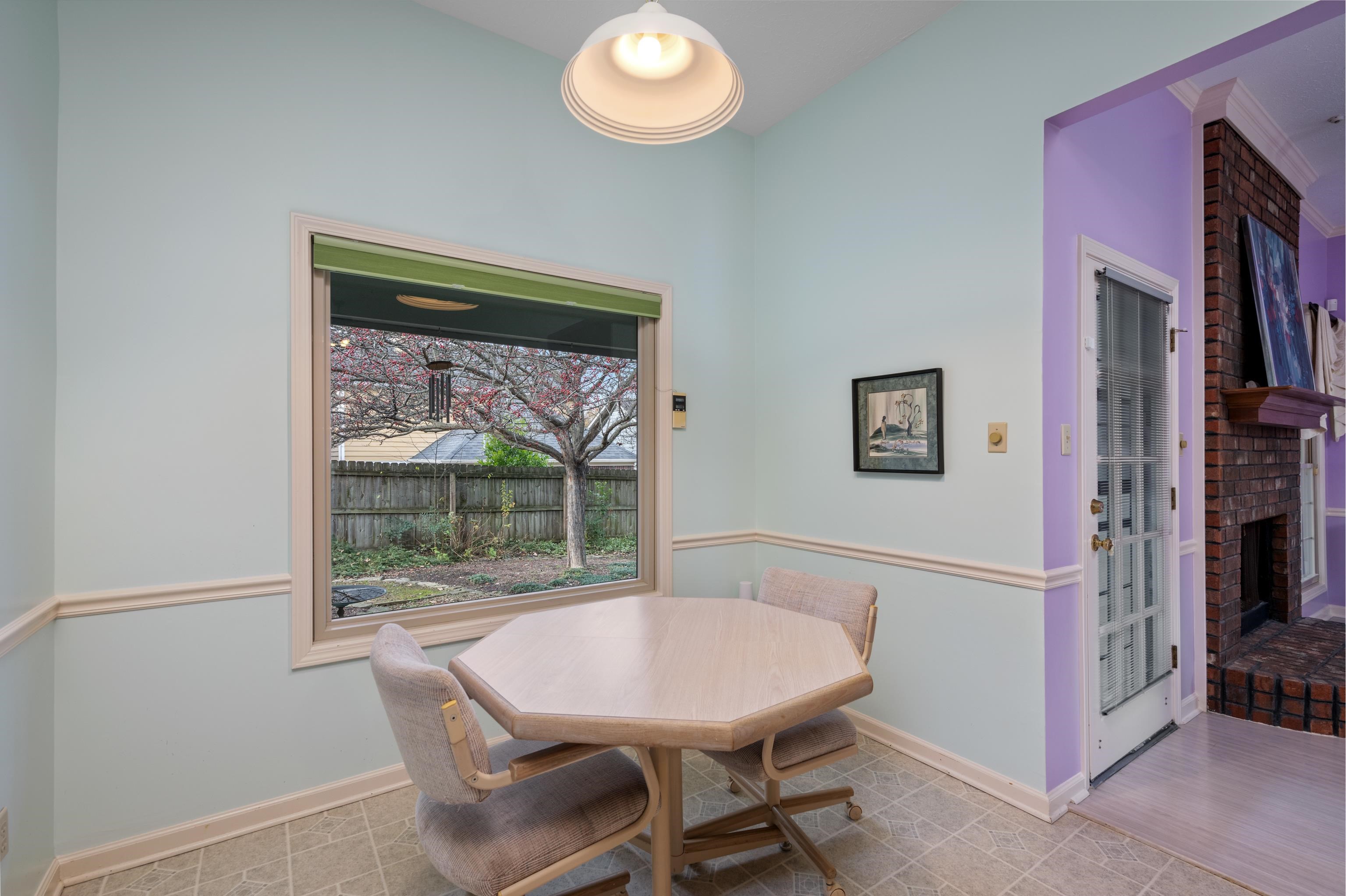 811 Vaughn Road Memphis, TN 38122 - Photo 14 of 33 a view of a dining room with furniture window and wooden floor