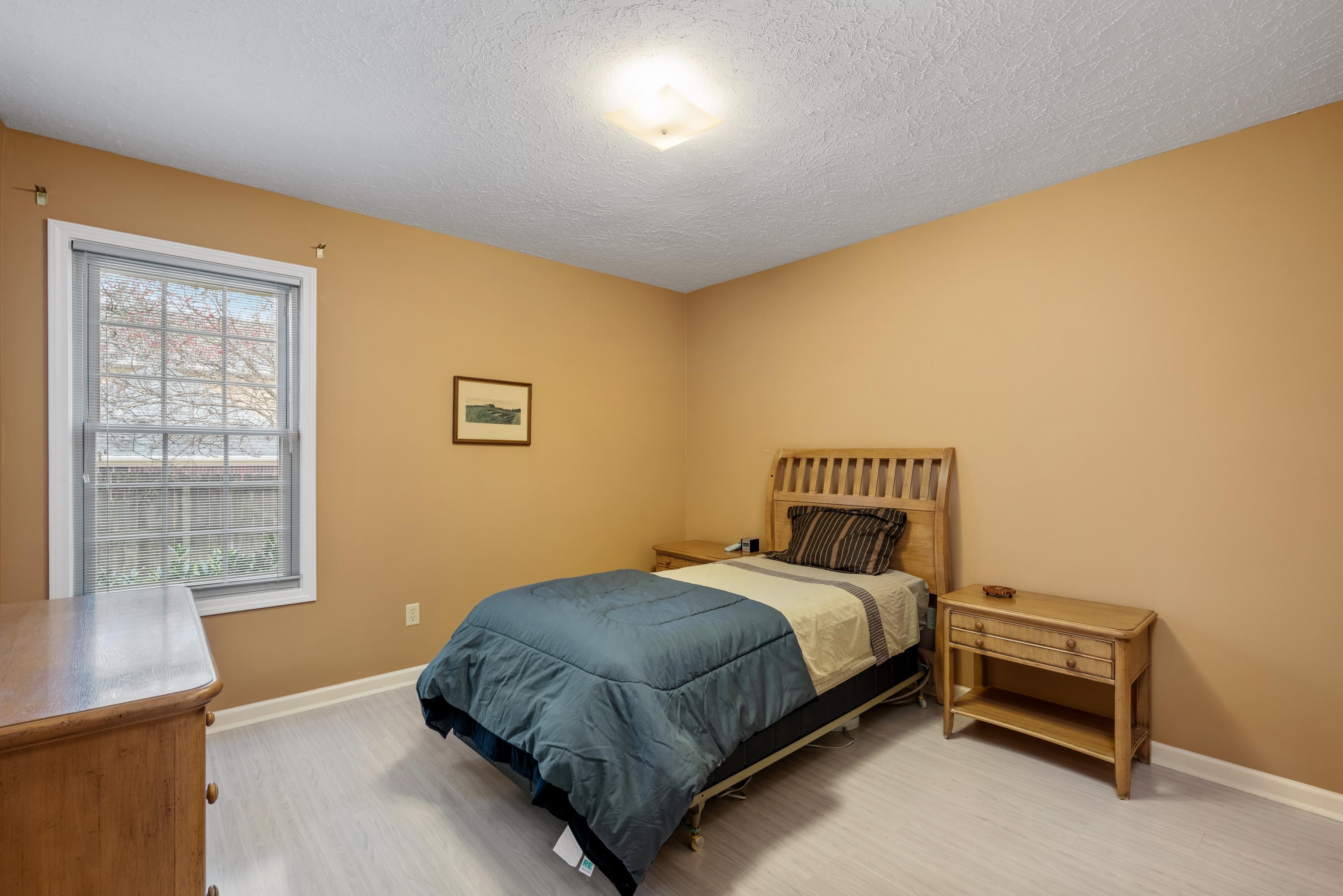 811 Vaughn Road Memphis, TN 38122 - Photo 23 of 33 a bedroom with a bed and a window