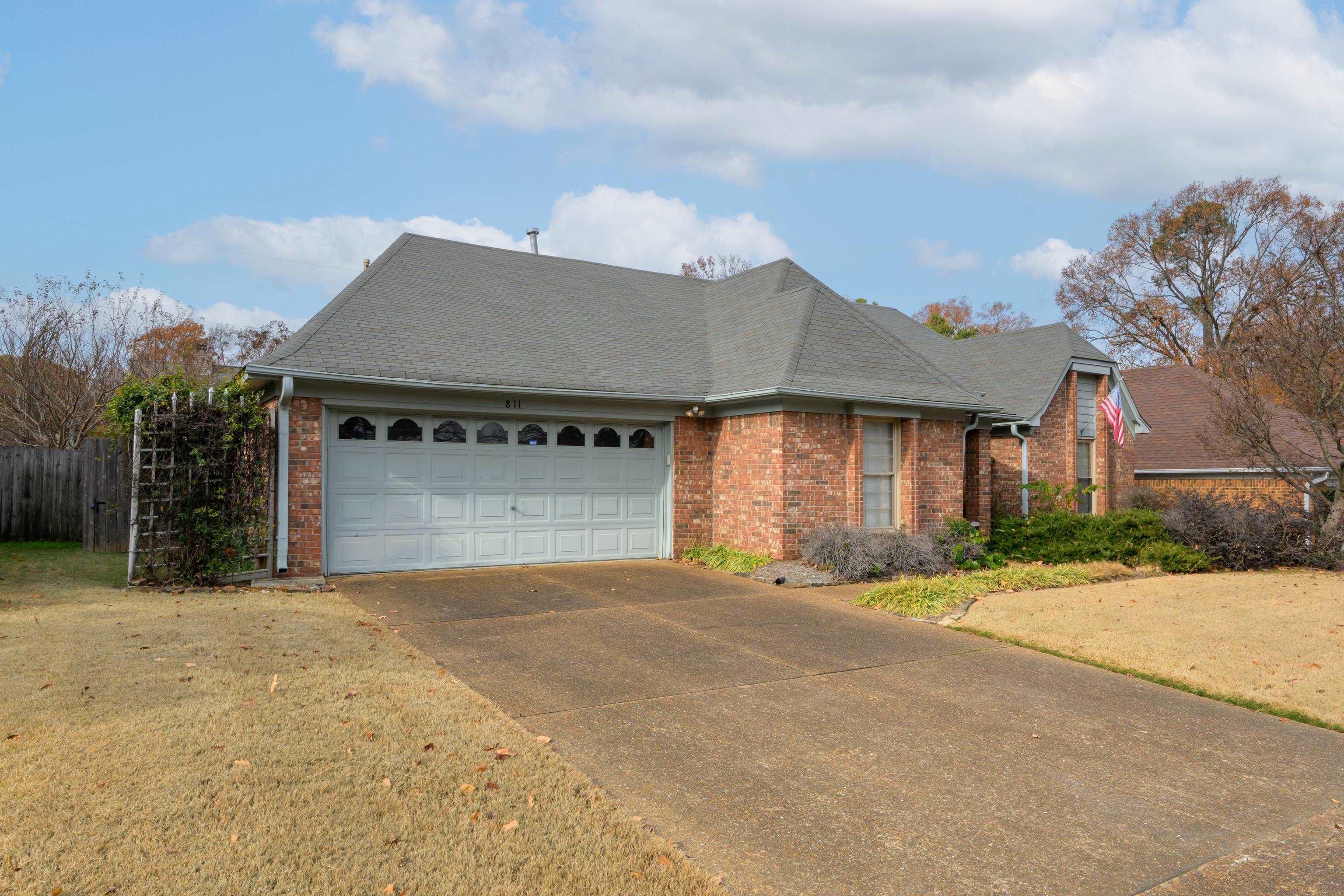 811 Vaughn Road Memphis, TN 38122 - Photo 33 of 33 a front view of a house with a yard and garage
