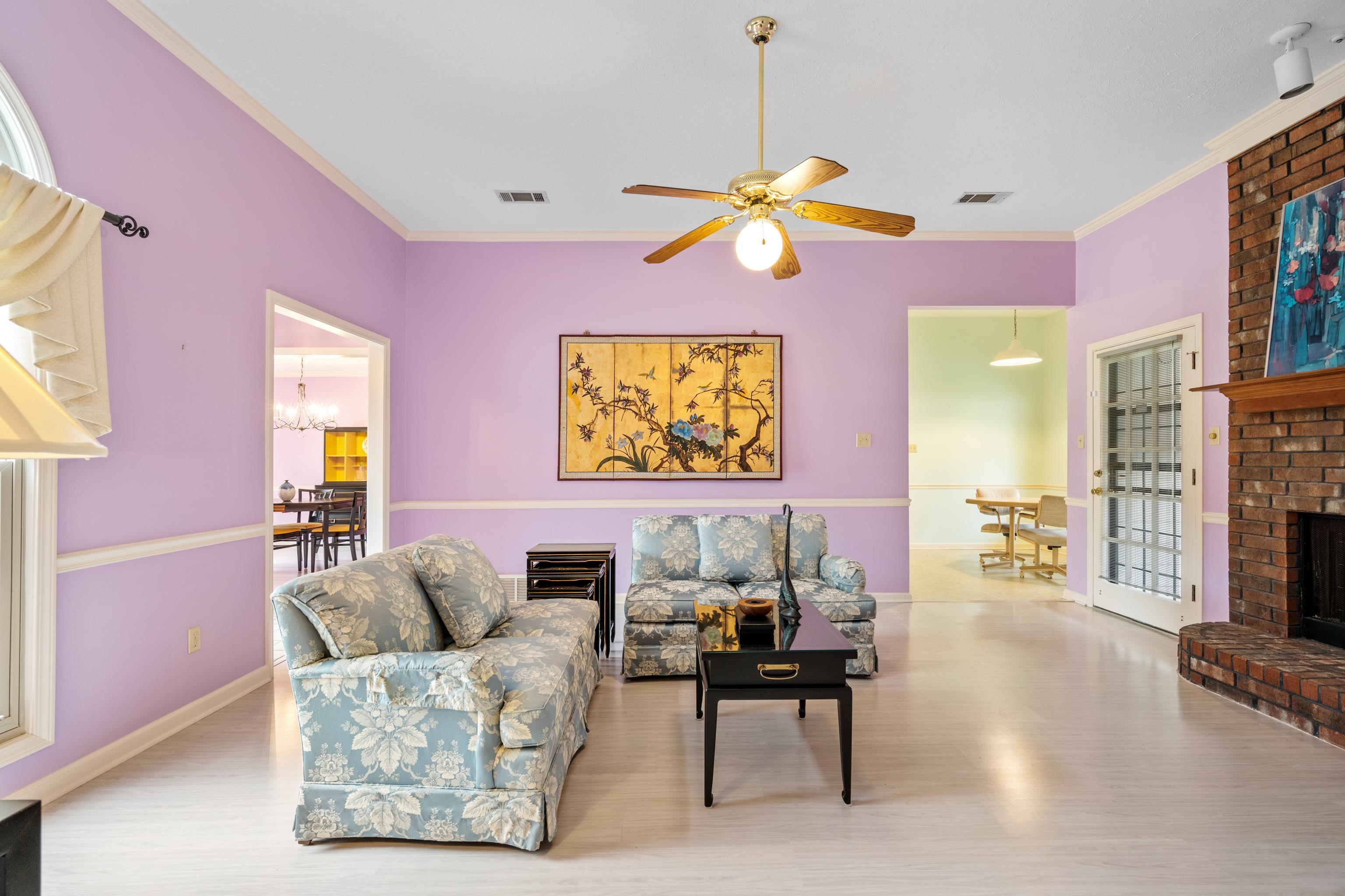 811 Vaughn Road Memphis, TN 38122 - Photo 6 of 33 a living room with fireplace furniture and a chandelier