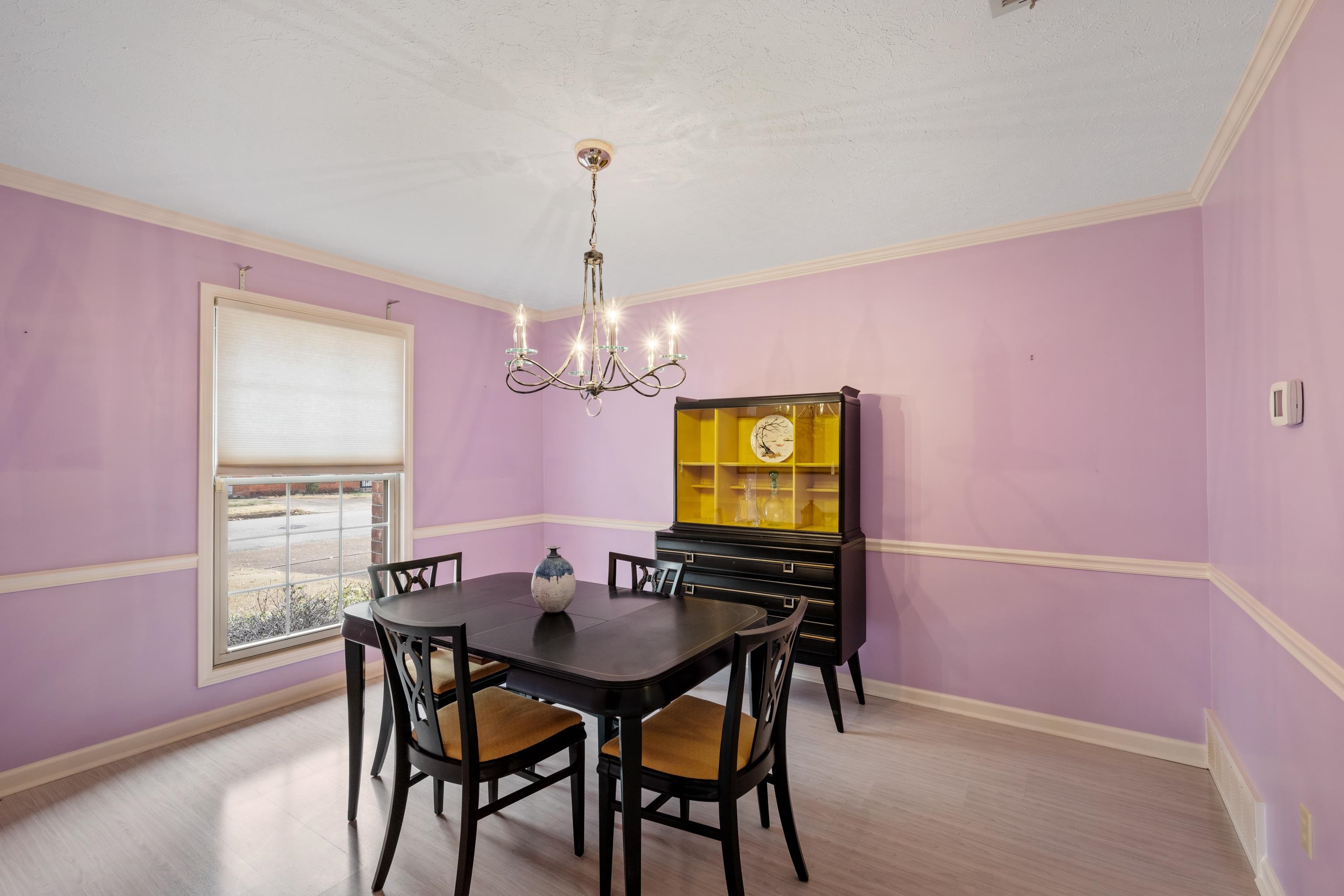 811 Vaughn Road Memphis, TN 38122 - Photo 7 of 33 a view of a dining room with furniture and a chandelier