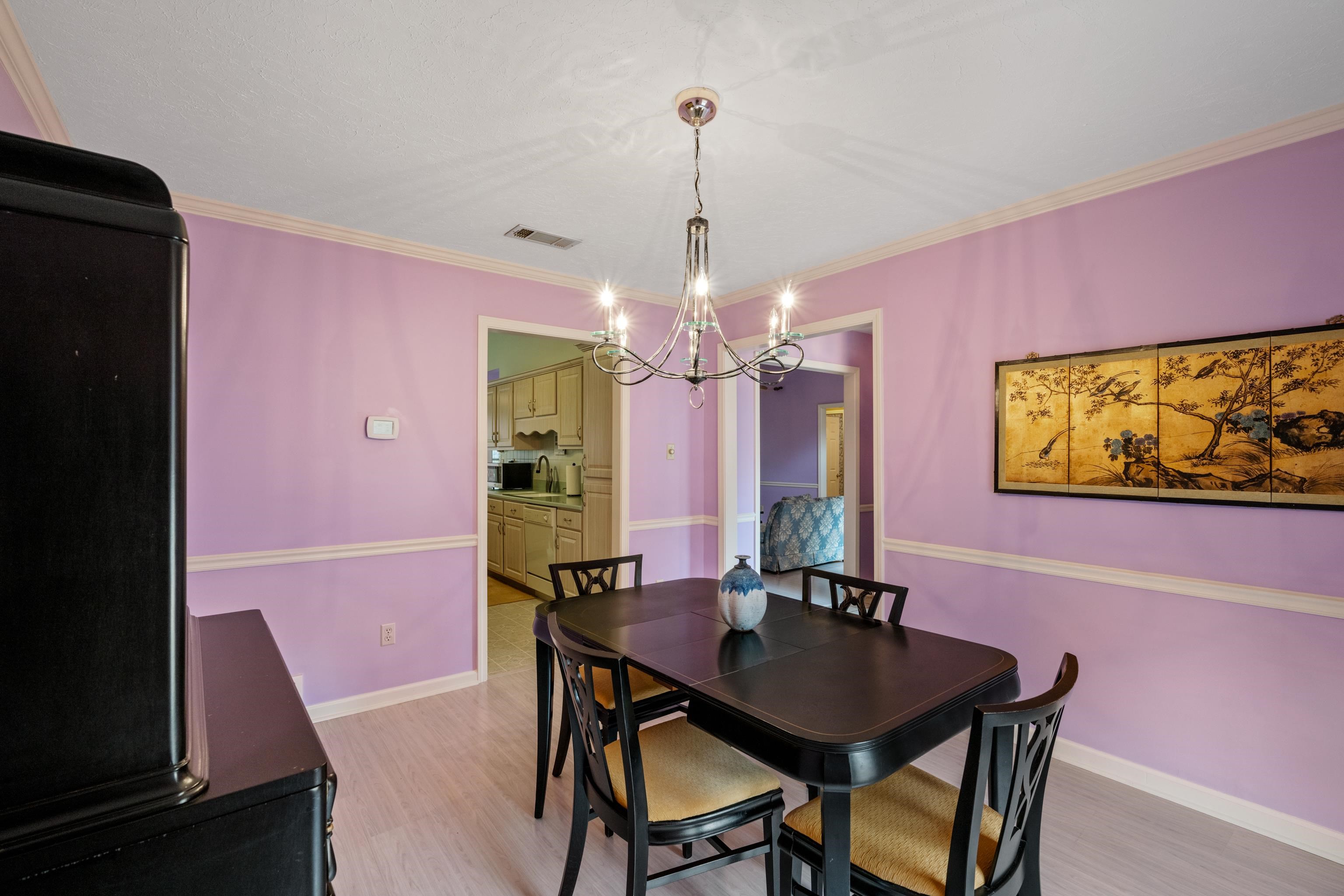 811 Vaughn Road Memphis, TN 38122 - Photo 8 of 33 a view of a dining room with furniture and chandelier