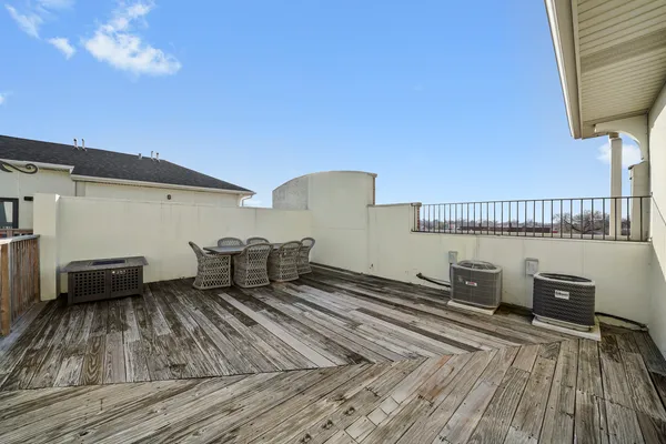 a couple of chairs sitting in front of a house