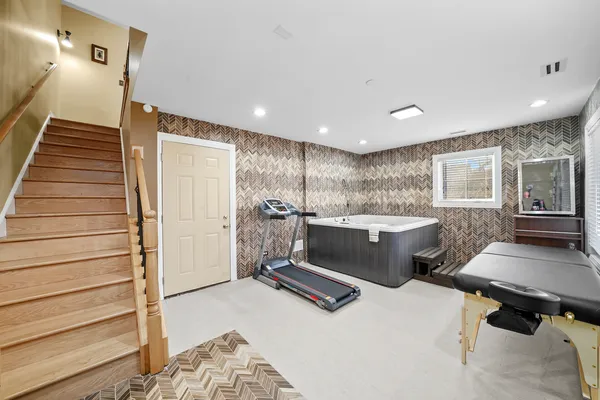 a spacious bathroom with a granite countertop sink and a mirror
