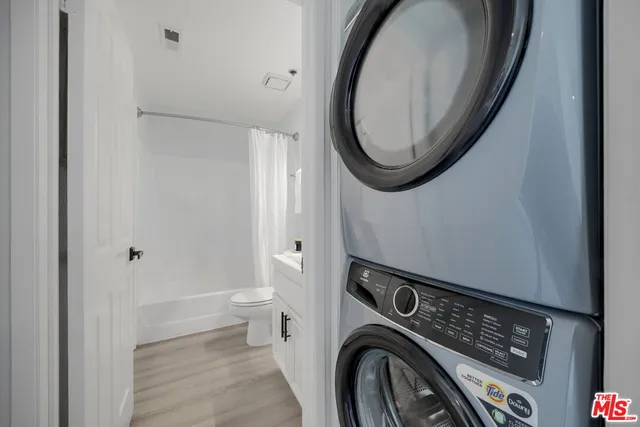a view of storage and utility room with washer and dryer