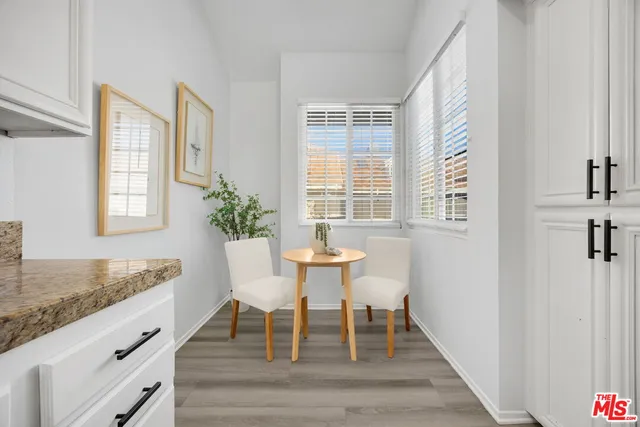 a view of a dining room with furniture and window